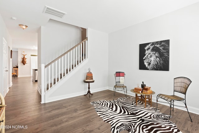 sitting room with dark hardwood / wood-style flooring