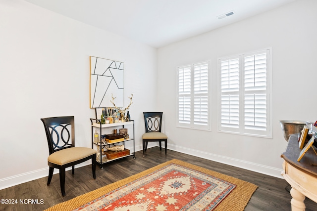 living area with dark hardwood / wood-style floors