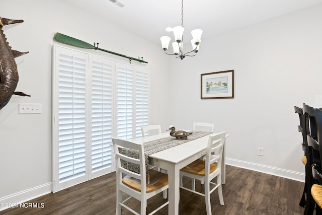 dining space with a notable chandelier and dark wood-type flooring