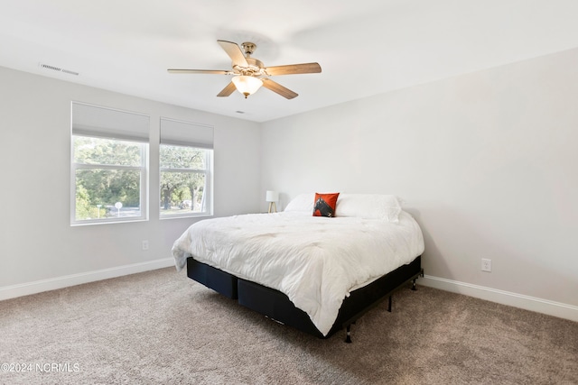 bedroom with ceiling fan and carpet flooring