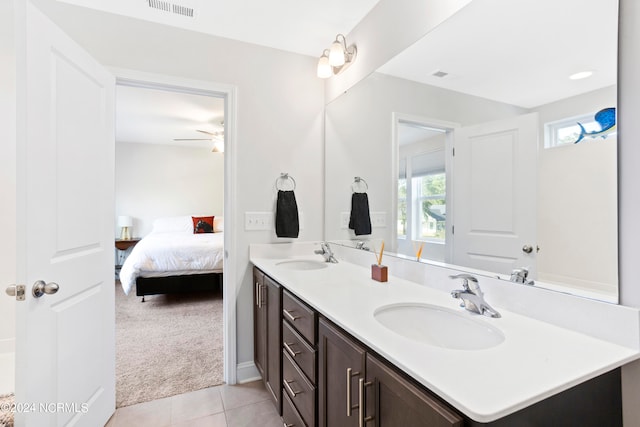 bathroom with tile patterned flooring and vanity