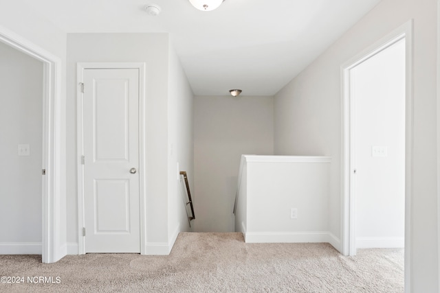 corridor with light carpet