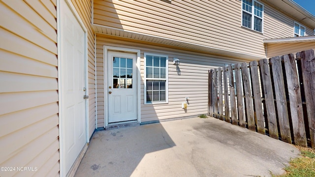 doorway to property with a patio area