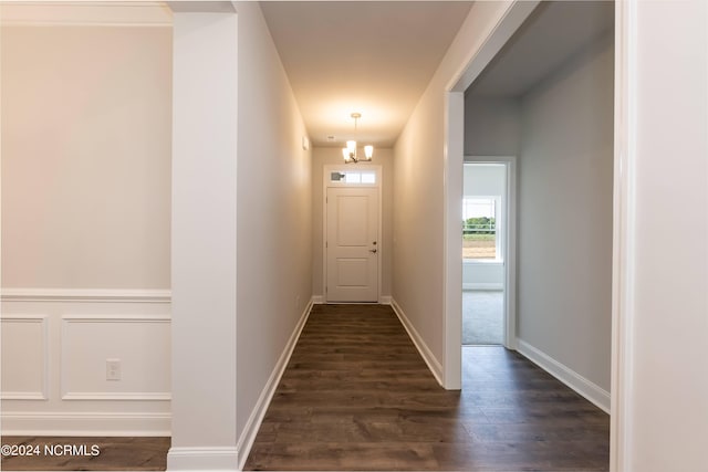 corridor featuring dark wood-type flooring