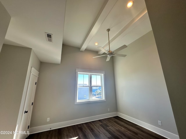 unfurnished room featuring beam ceiling, ceiling fan, and dark hardwood / wood-style floors