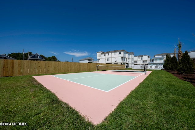 view of sport court with a yard and tennis court