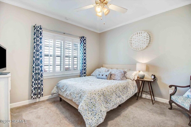 bedroom featuring ornamental molding, light colored carpet, baseboards, and a ceiling fan