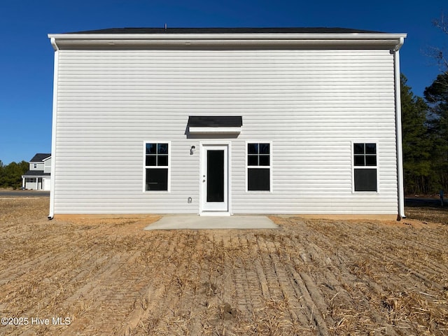 back of house with a patio