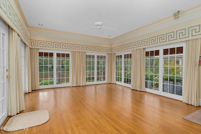 interior space with ceiling fan