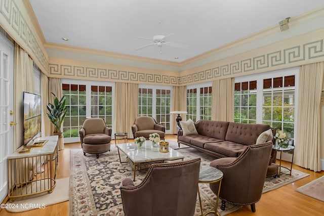 sunroom / solarium with plenty of natural light and ceiling fan