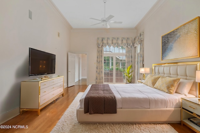 bedroom with ornamental molding, light hardwood / wood-style floors, and ceiling fan