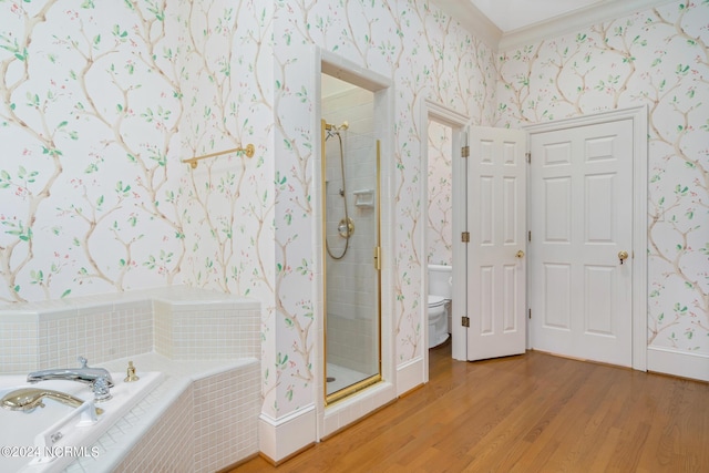 bathroom with hardwood / wood-style flooring, toilet, independent shower and bath, and crown molding