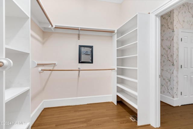 walk in closet featuring hardwood / wood-style floors