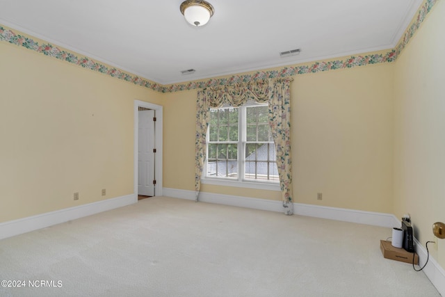 carpeted empty room with crown molding