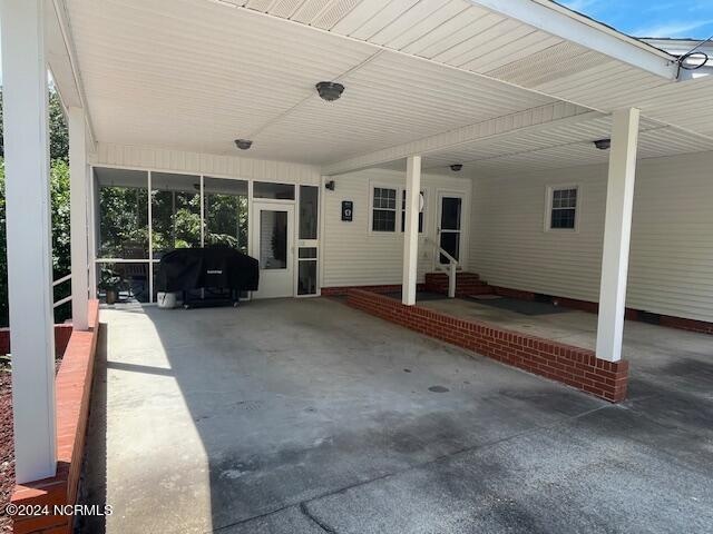 view of patio / terrace featuring a carport