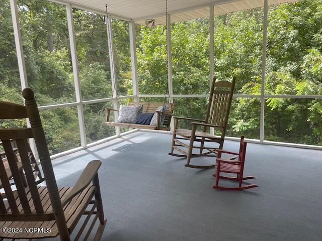 sunroom / solarium featuring plenty of natural light