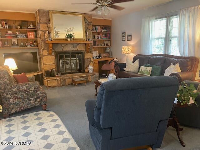 living room with a fireplace, light colored carpet, and ceiling fan