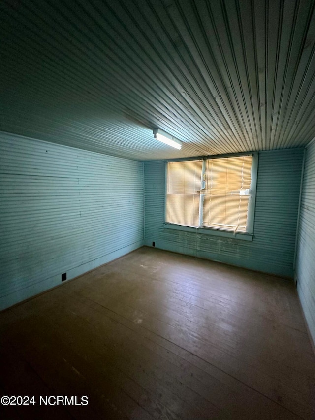 empty room featuring hardwood / wood-style flooring