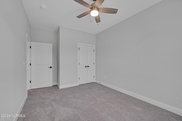 unfurnished bedroom with ceiling fan and light carpet