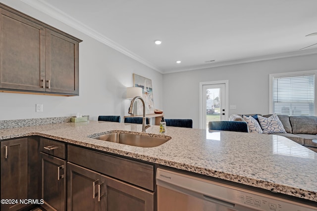 kitchen with crown molding, dark brown cabinets, dishwasher, sink, and light stone countertops