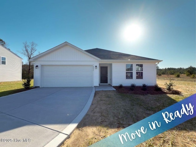 ranch-style house with concrete driveway and a garage