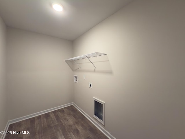 laundry area featuring baseboards, hookup for an electric dryer, laundry area, washer hookup, and dark wood-type flooring