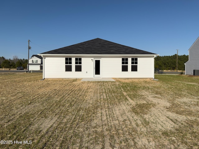 rear view of property with a patio area and central air condition unit