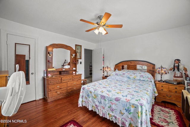 bedroom featuring dark hardwood / wood-style flooring and ceiling fan