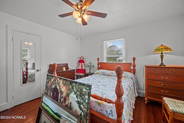 bedroom featuring dark wood-type flooring and ceiling fan