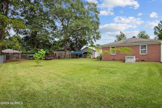 view of yard with central AC unit