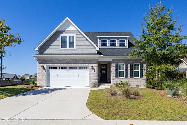 craftsman inspired home with a front yard and a garage