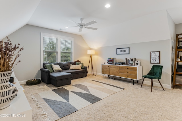 carpeted living room with vaulted ceiling and ceiling fan