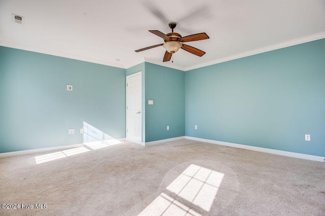 empty room with light carpet, ceiling fan, and ornamental molding