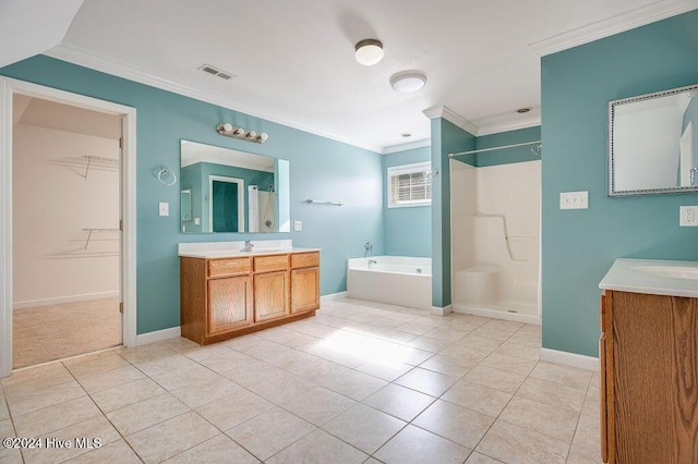 bathroom with tile patterned flooring, vanity, ornamental molding, and shower with separate bathtub