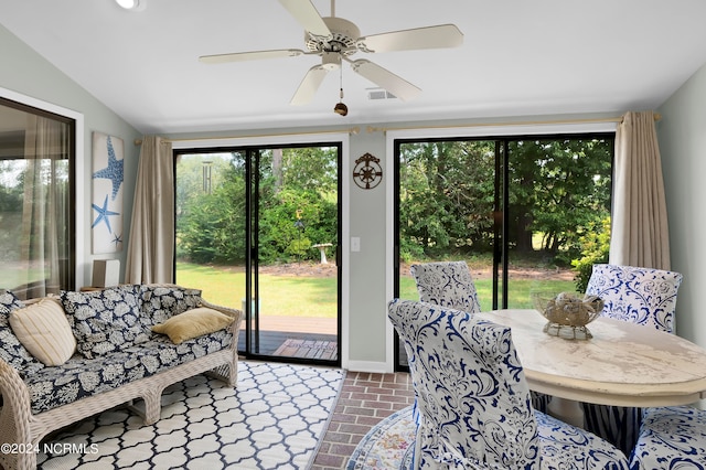 interior space featuring lofted ceiling and ceiling fan