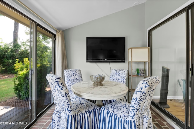 dining room with vaulted ceiling