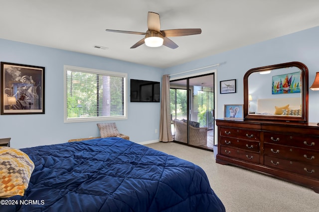 bedroom with ceiling fan, a closet, and light carpet