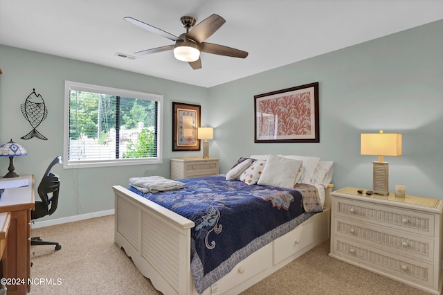 bedroom featuring ceiling fan and light colored carpet