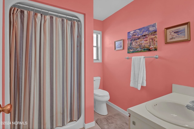 bathroom with curtained shower, tile patterned flooring, toilet, and vanity