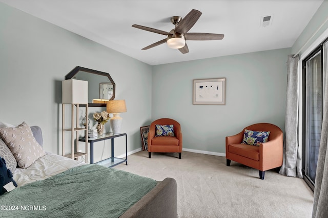 bedroom with ceiling fan and light carpet