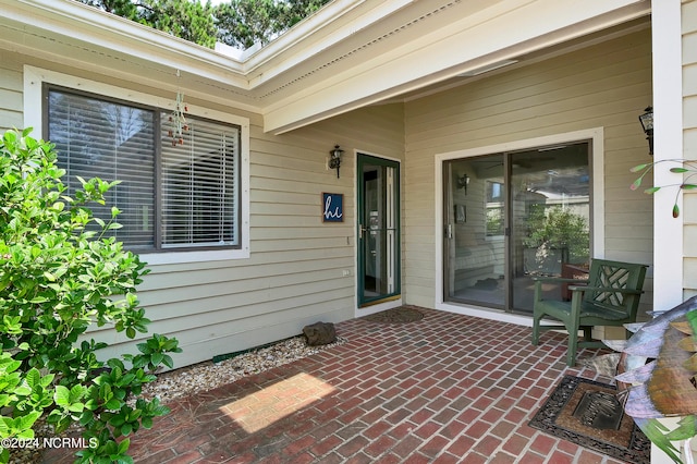 entrance to property featuring a patio