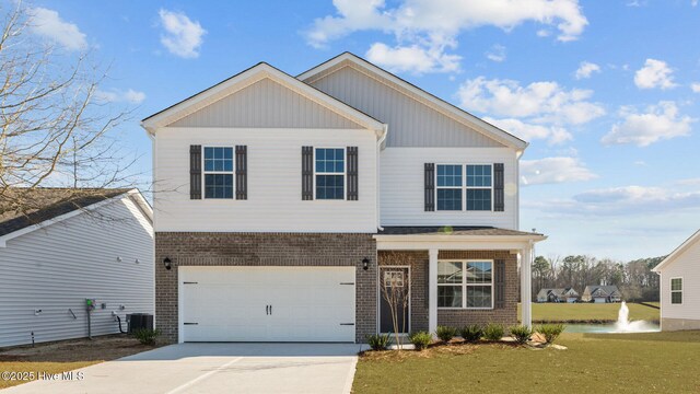 view of front facade featuring a front yard and a garage