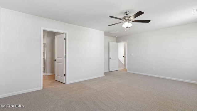 unfurnished bedroom with light colored carpet and ceiling fan