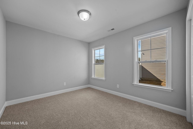 spare room with carpet flooring