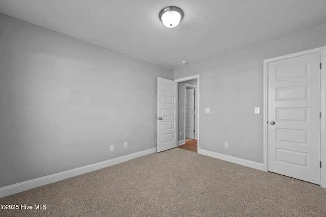 unfurnished bedroom featuring carpet