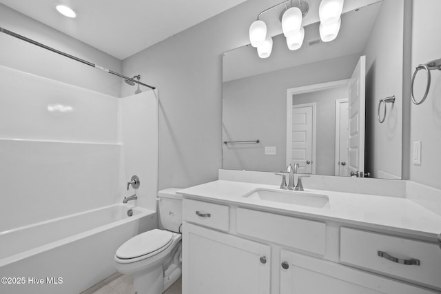 full bathroom with vanity, bathing tub / shower combination, and toilet