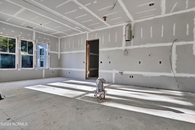 empty room with concrete flooring