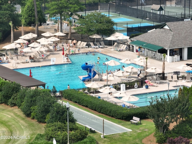 view of swimming pool with a patio area