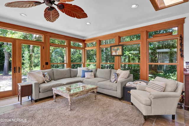 living room featuring french doors and ceiling fan