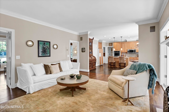 living room featuring crown molding and light wood-type flooring